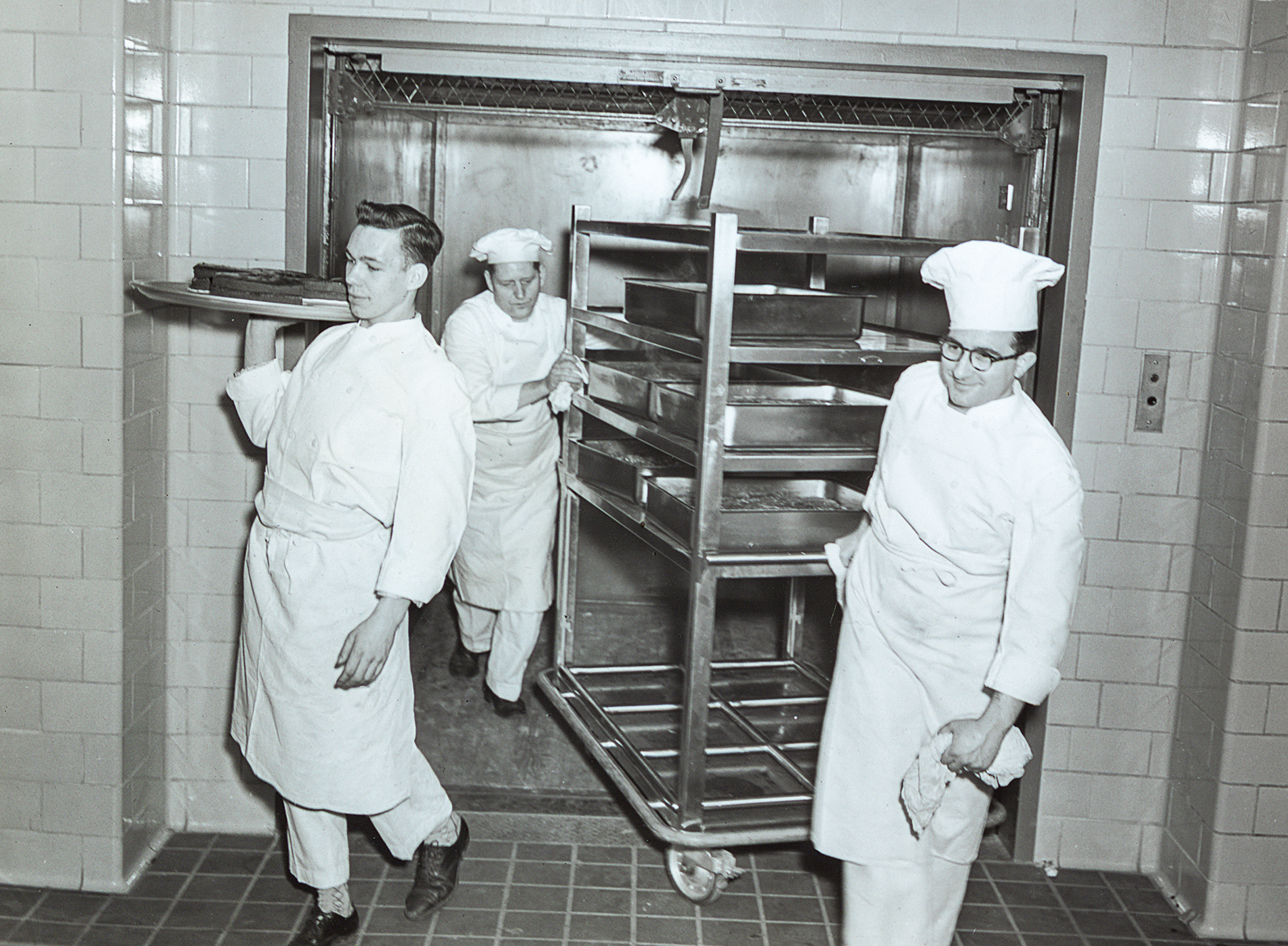 Ratty servers in the kitchen, 1950s